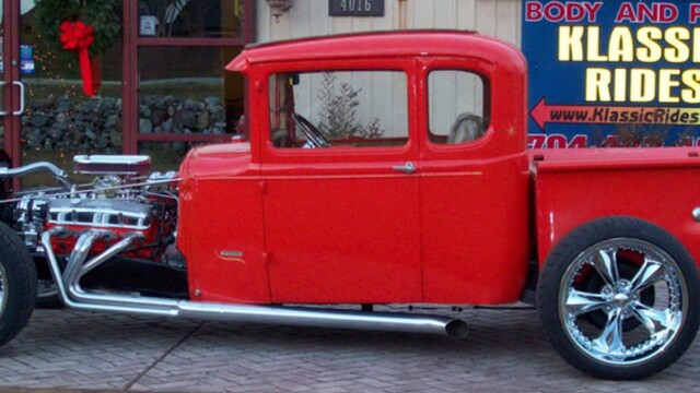 Red classic hot rod pickup truck.
