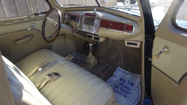 Classic car interior, tan seats.