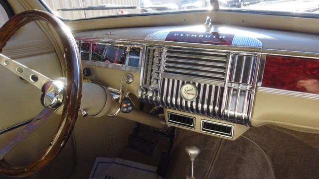 Vintage Plymouth car interior dashboard.