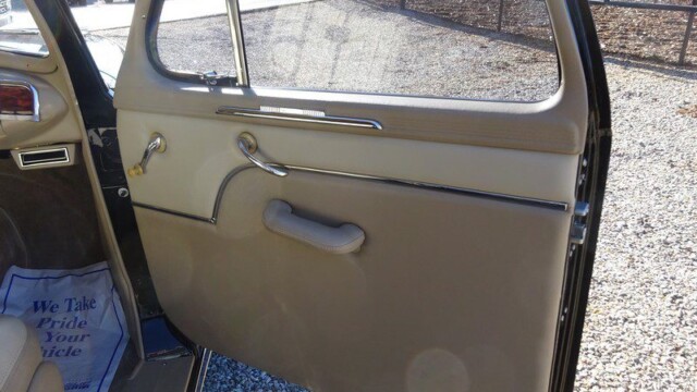 Beige car door interior detail.