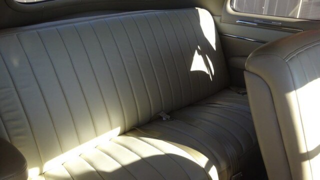 Beige car interior back seats.