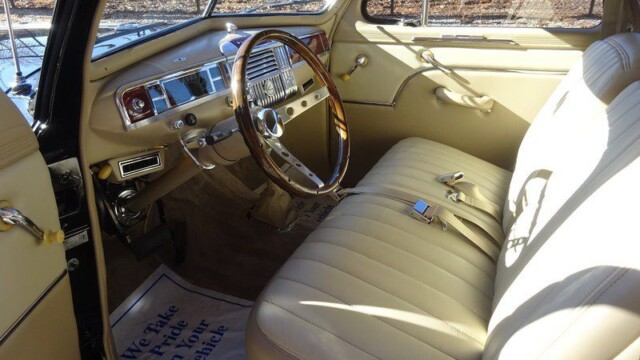 Classic car interior, cream leather seats.