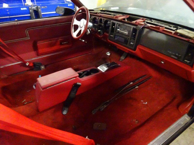 Red car interior, under construction.