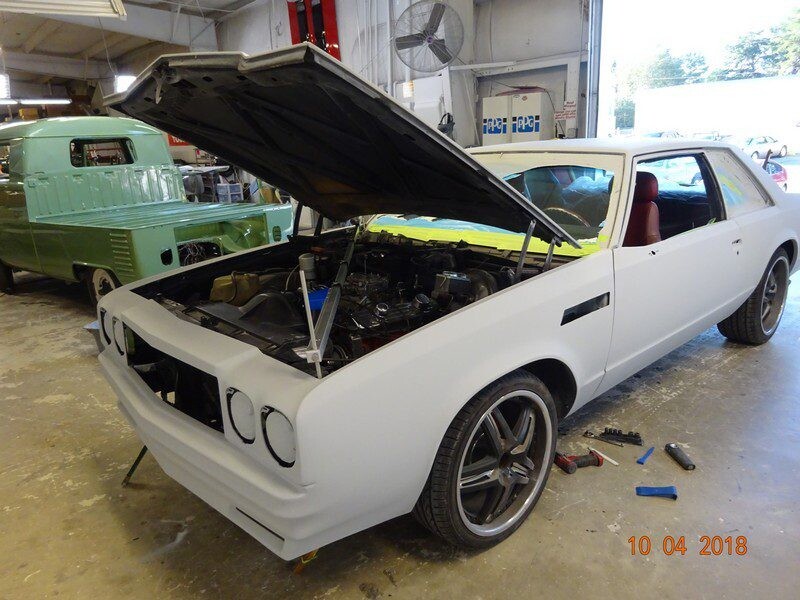 Primered classic car under repair.