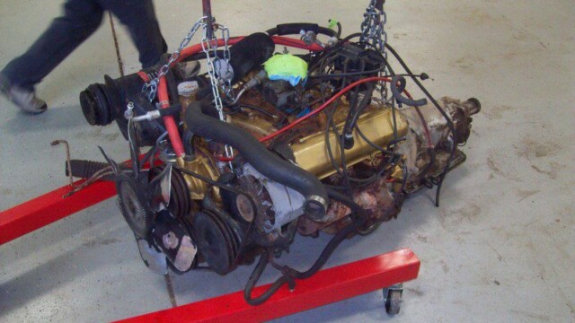 Small-block V8 engine on engine stand.