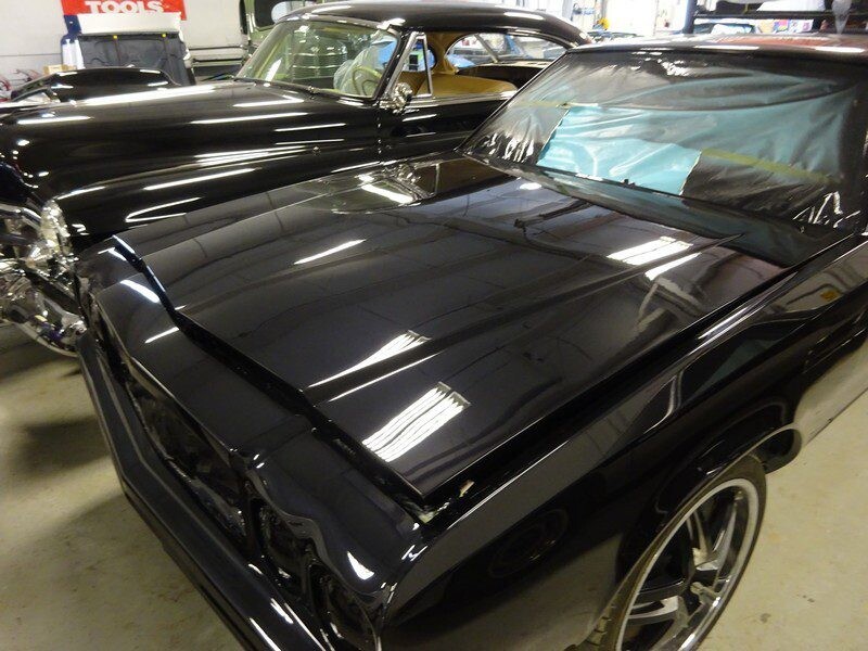 Shiny black classic car, freshly painted.