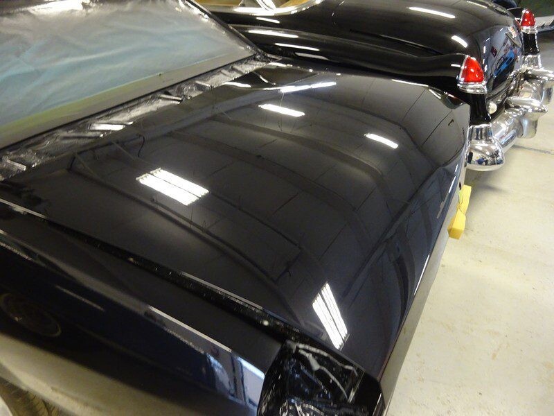 Shiny black car hood, detail shot.