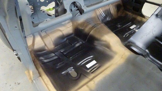 Car floor pan, primed and ready.