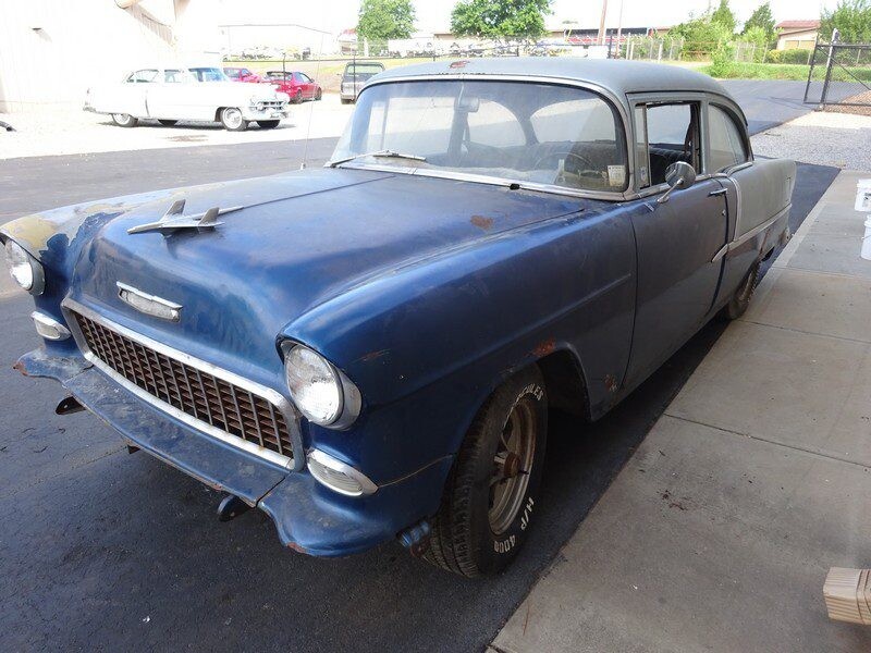 Blue 1955 Chevy needing restoration.