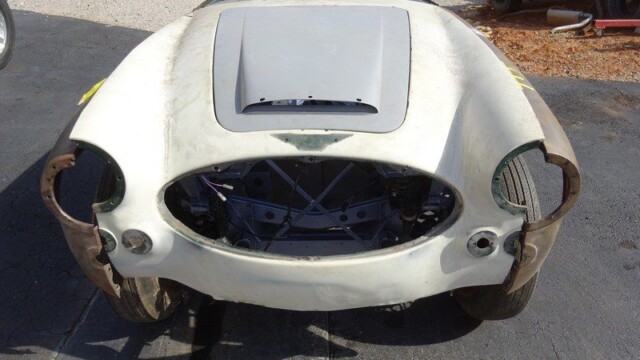White classic car body restoration project.