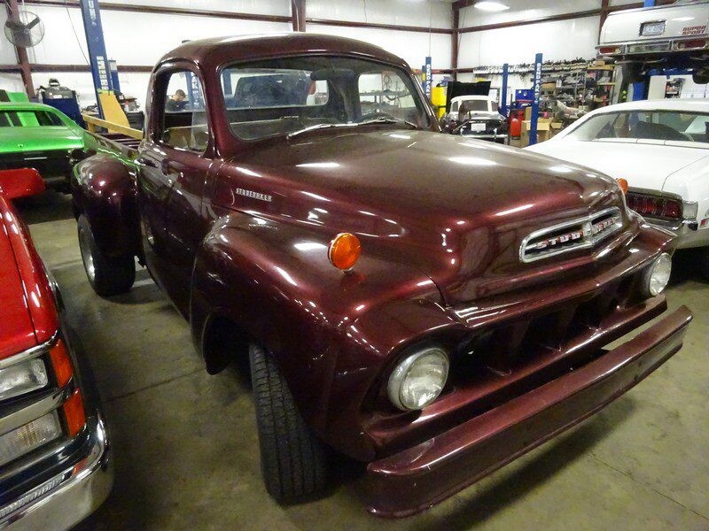 Maroon Studebaker pickup truck.