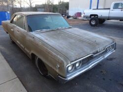 Dusty vintage Dodge Polara coupe.