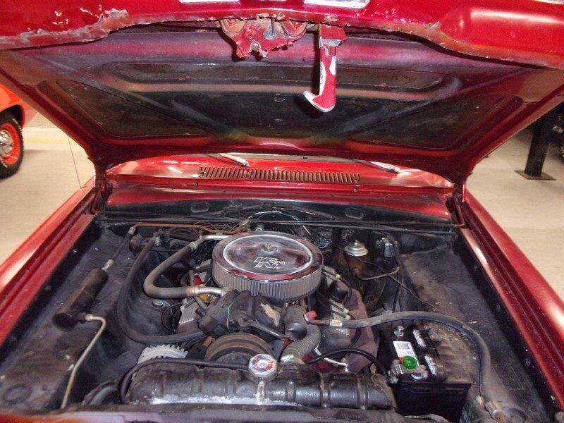 Red classic car engine bay.