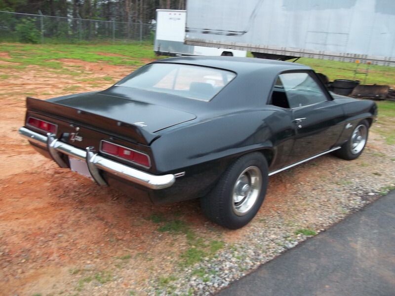 Black classic Camaro rear view.