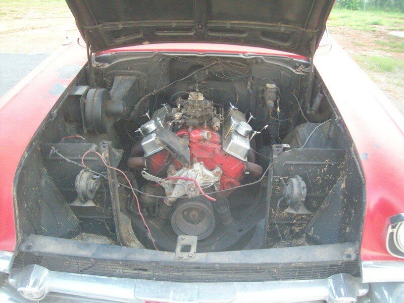 Red classic car engine bay.