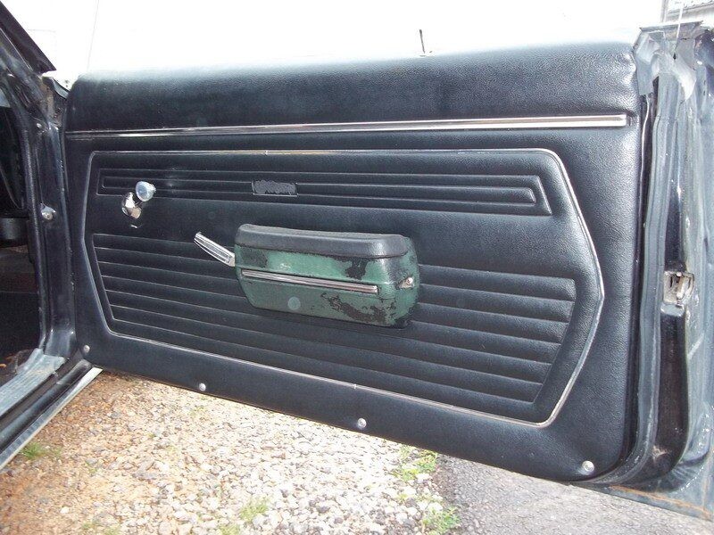 Black Camaro interior door panel.