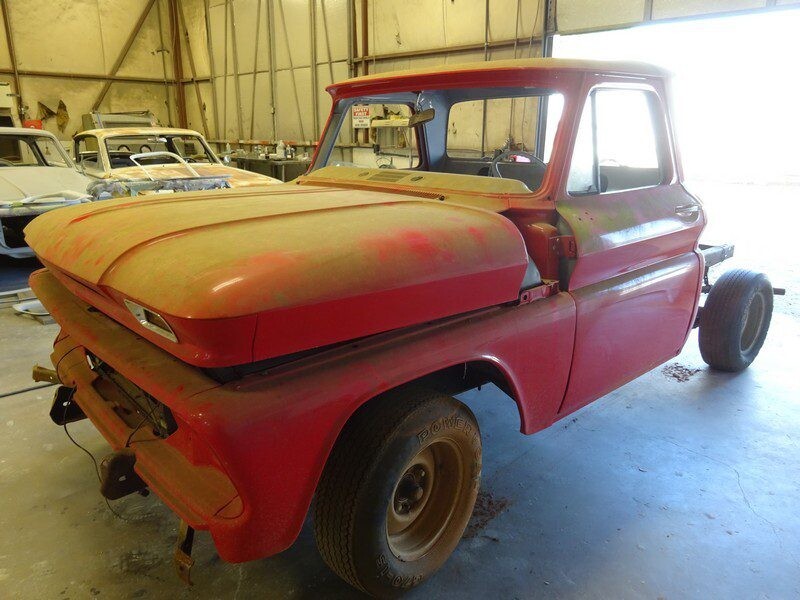 Dusty red classic Chevy truck restoration.