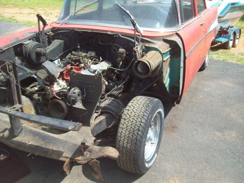 Stripped-down red 1957 Chevy engine.