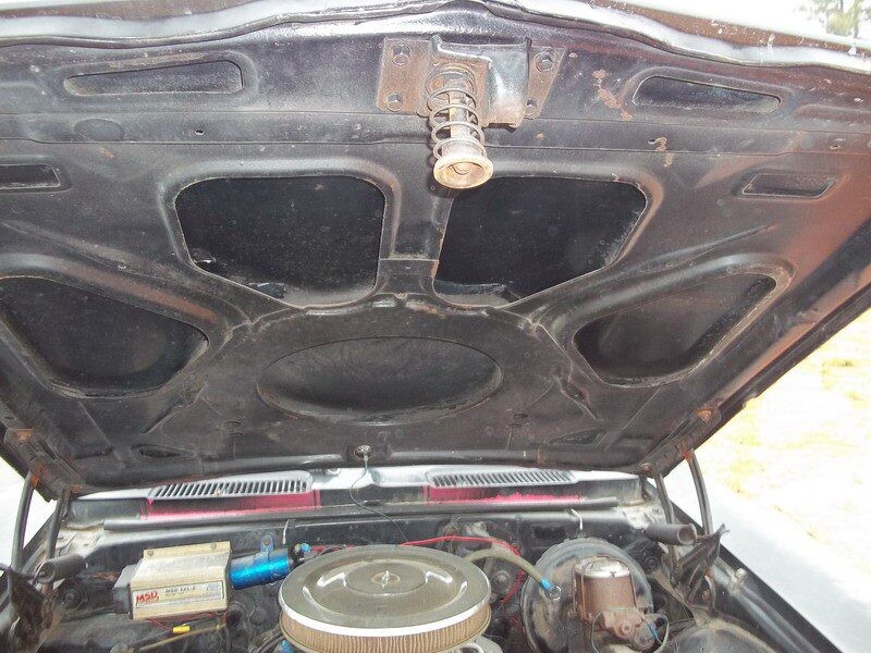 Classic car engine bay under hood.