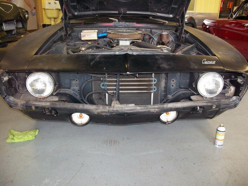 Black Camaro front end, under repair.