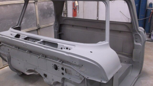 Primered classic truck cab body shell.