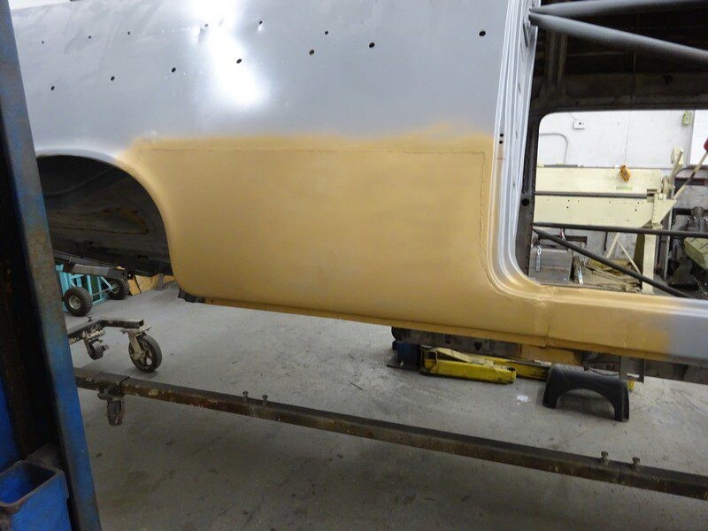 Car body panel primed for paint.