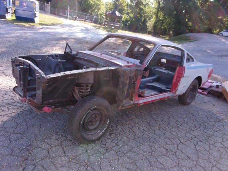 Stripped classic Ford Mustang shell.