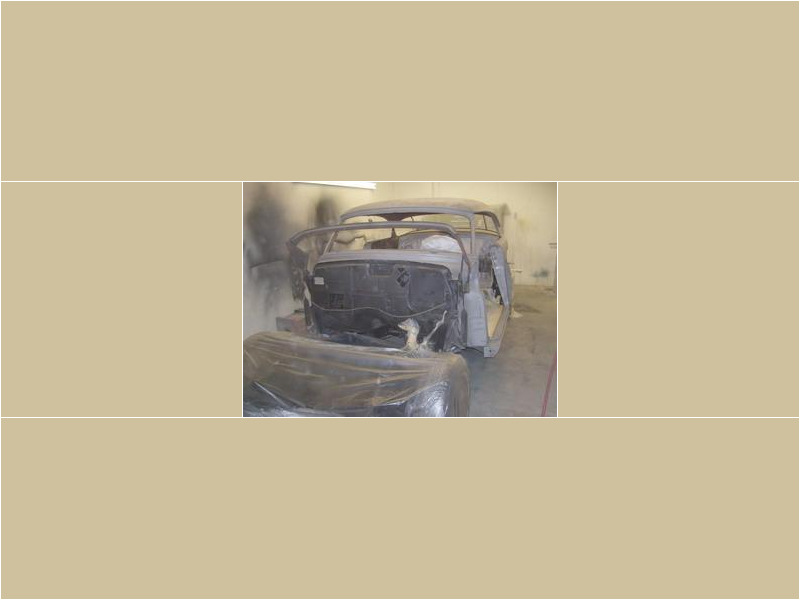 Here's a short alt tag for the image: Classic car undergoing restoration.