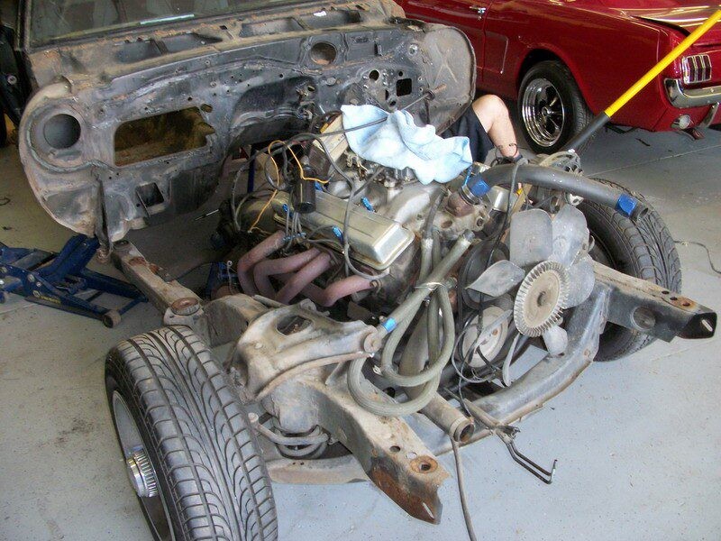Classic car engine being rebuilt.