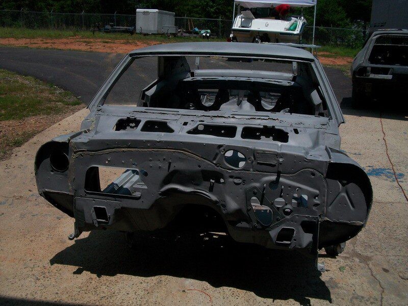 Stripped classic car body shell.