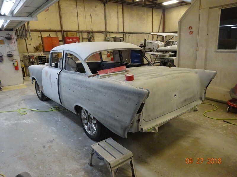 Primered 1957 Chevy Bel Air body.