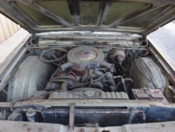 Rusty vintage car engine bay.