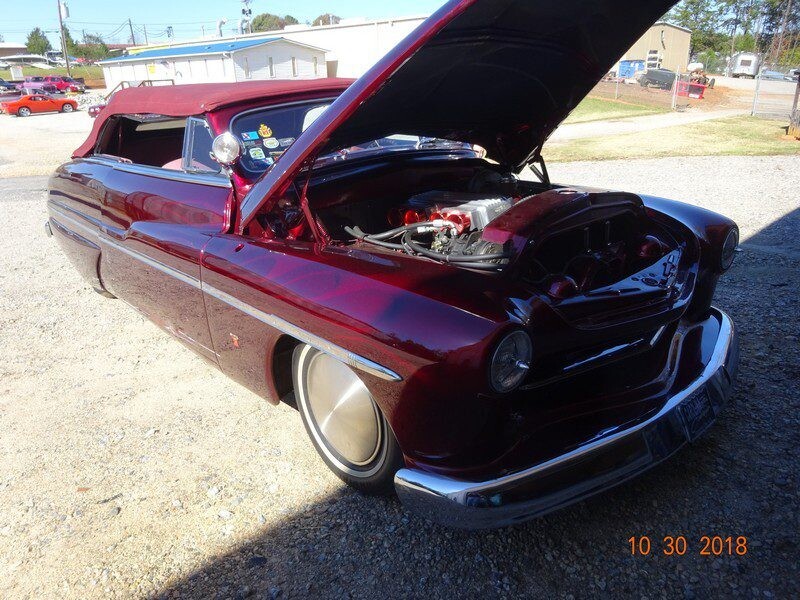 Custom maroon 1950 Mercury convertible.