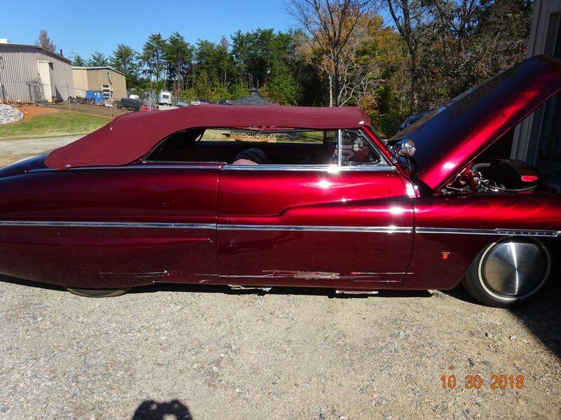 Custom red Mercury convertible classic car.