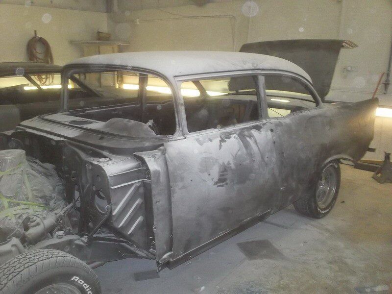 Gray primered classic car in progress.