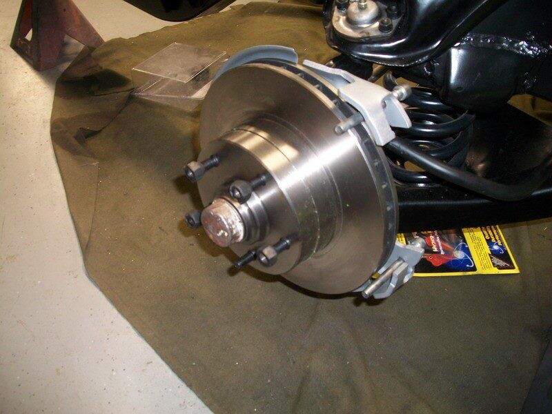 Car disc brake assembly installation.
