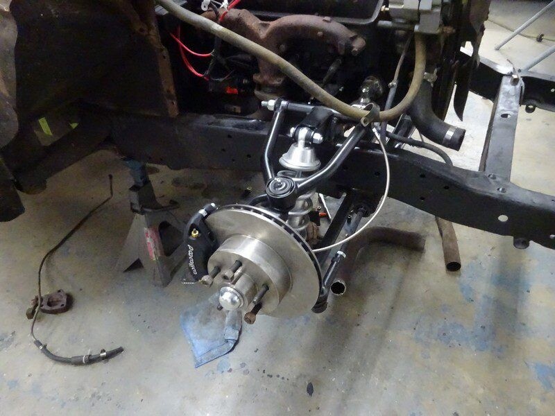 Car's front suspension and brake assembly.