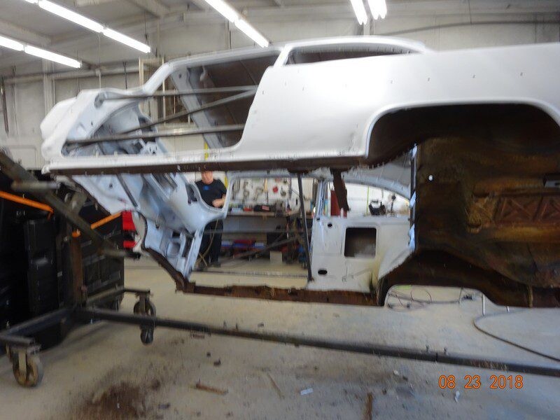 Classic car body restoration in progress.