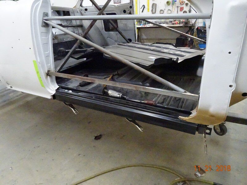 Classic car body restoration in progress.