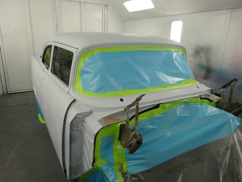 Classic car body in paint booth.