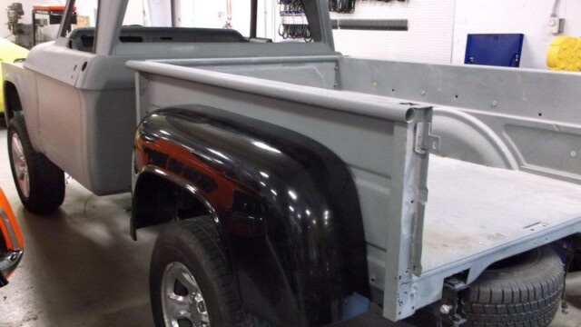 Gray vintage pickup truck, rear view.