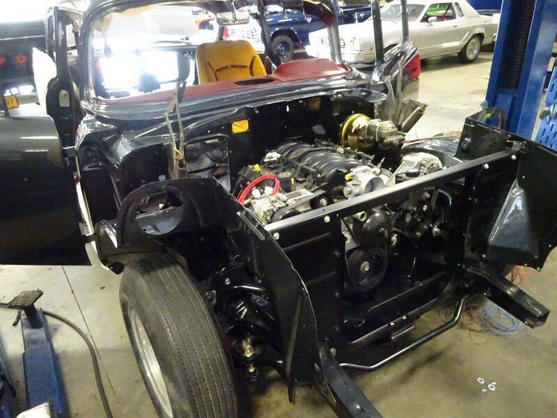 Classic car engine bay restoration in progress.