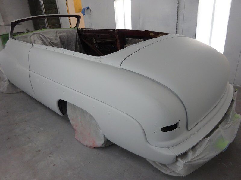 Primered vintage convertible car body.