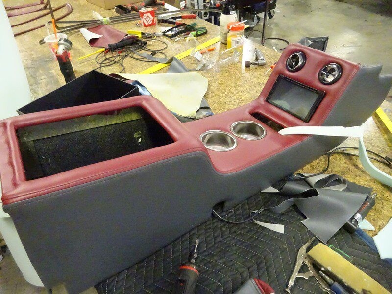 Custom car console with red and gray leather.