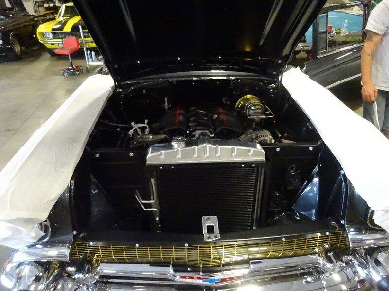 Black classic car engine detail.
