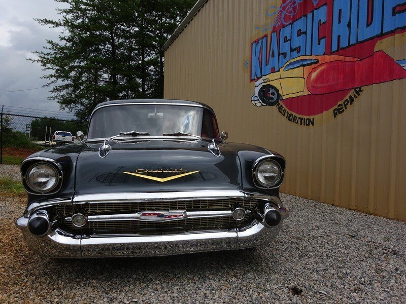 Black classic Chevrolet car, front view.