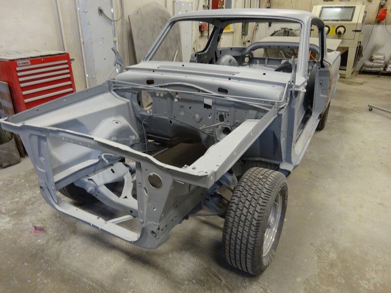 Classic car body restoration in progress.