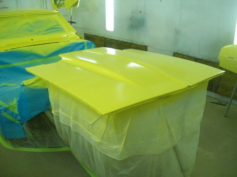 Freshly painted yellow car hood.
