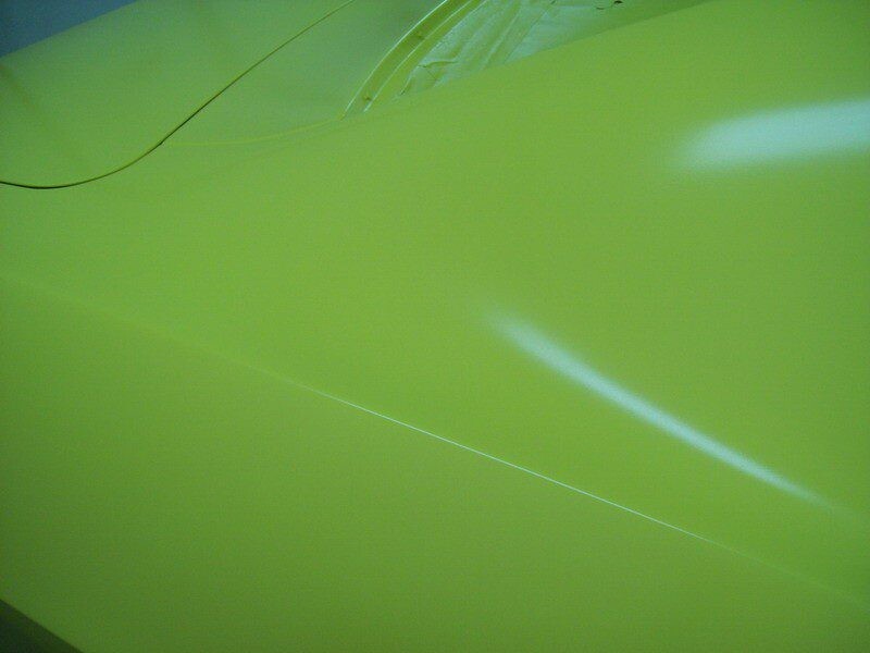 Lime green car body panel detail.