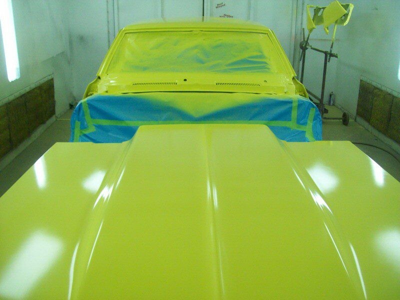 Freshly painted yellow car hood.